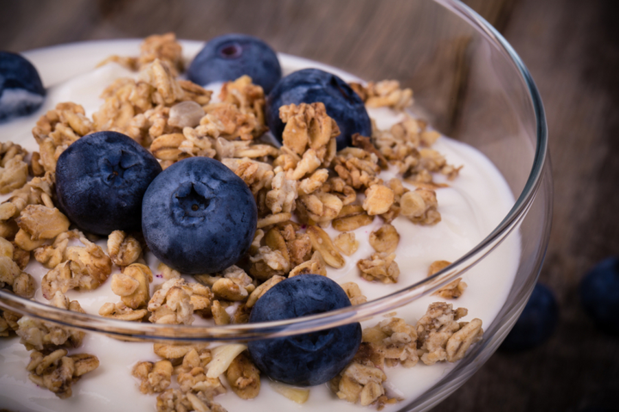 Yogurt with granola and blueberries.