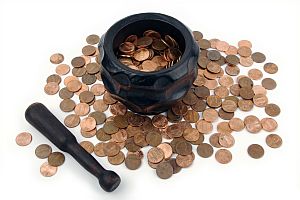 Grinding for Pennies - Wood mortar, pestle & pennies.