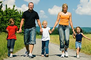 Family walking a dirtroad